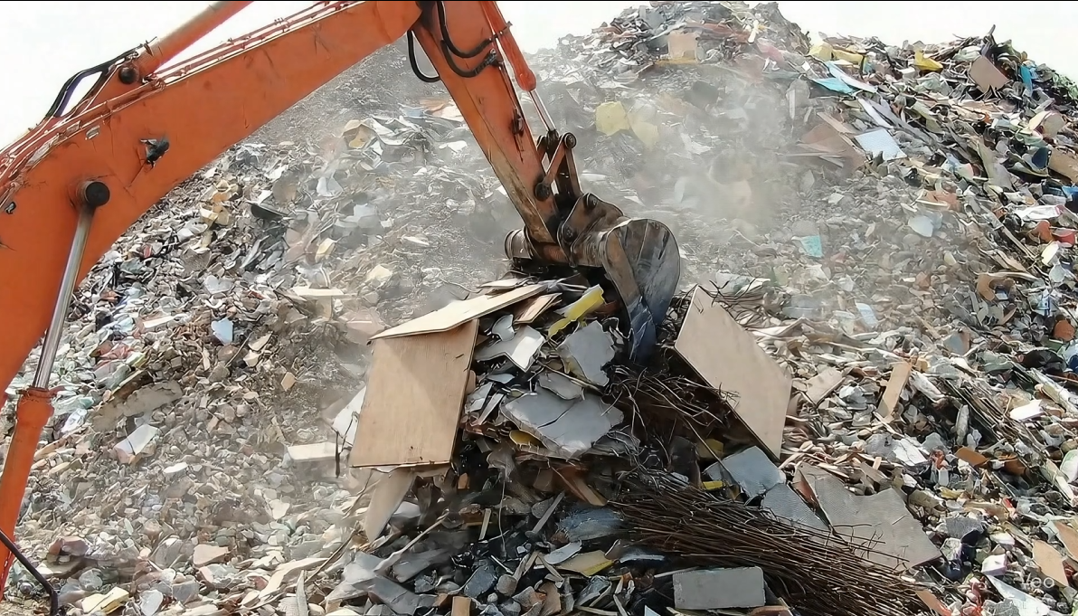 Photo of a silhouette of 2 dancers posing in front of a red curtain.